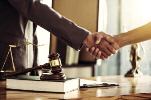 real estate attorney shaking hands with client